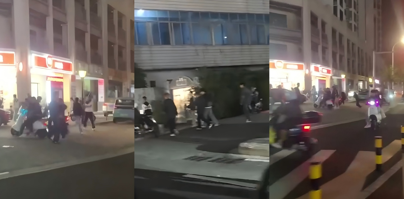 海南海口精神小伙打群架 两方钢管长棍火拼 打得红绿灯路口乱成一片