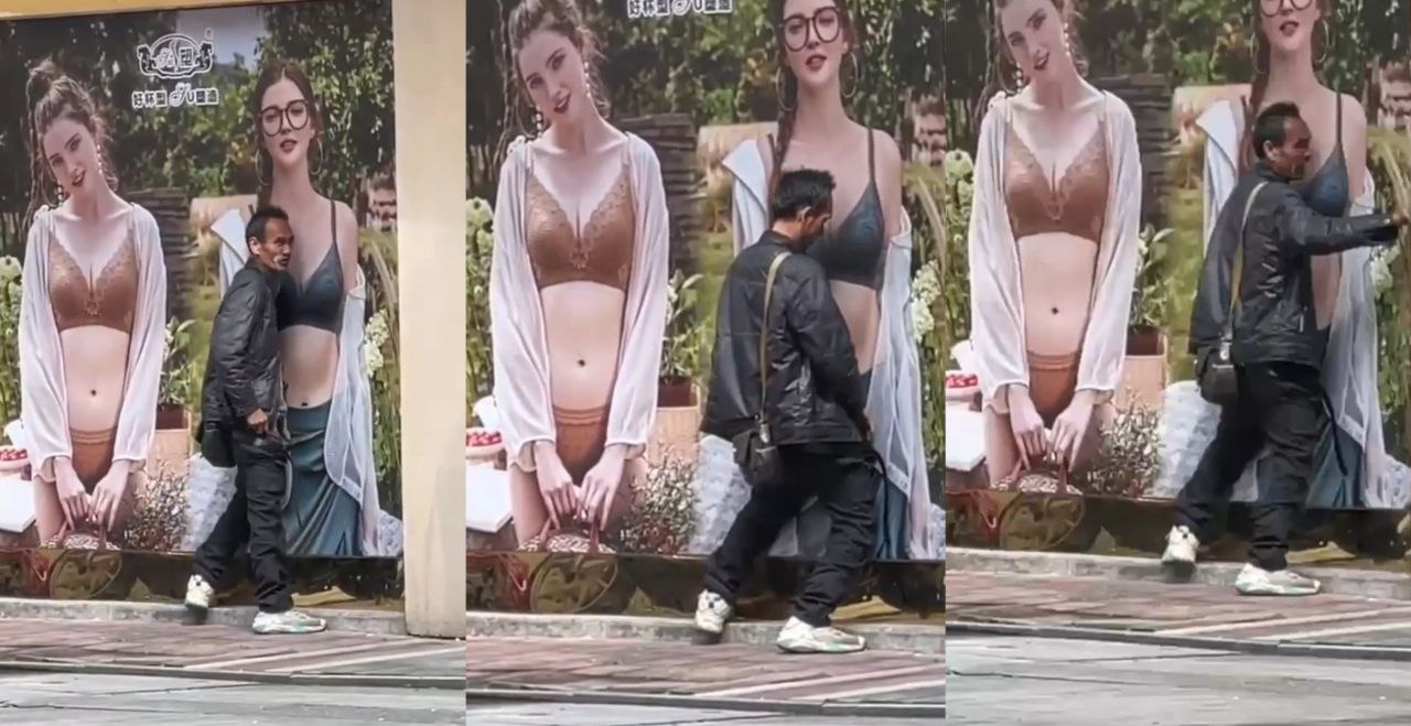 这是真饿急眼了 大街上一男子对广告牌竟然行不雅之事 大叔是多久没碰过女人！