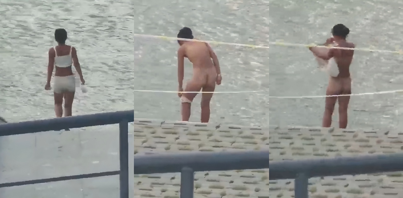大白天江边惊呆众人 女子喝口水就脱光裸泳 拍视频的咋那么准？