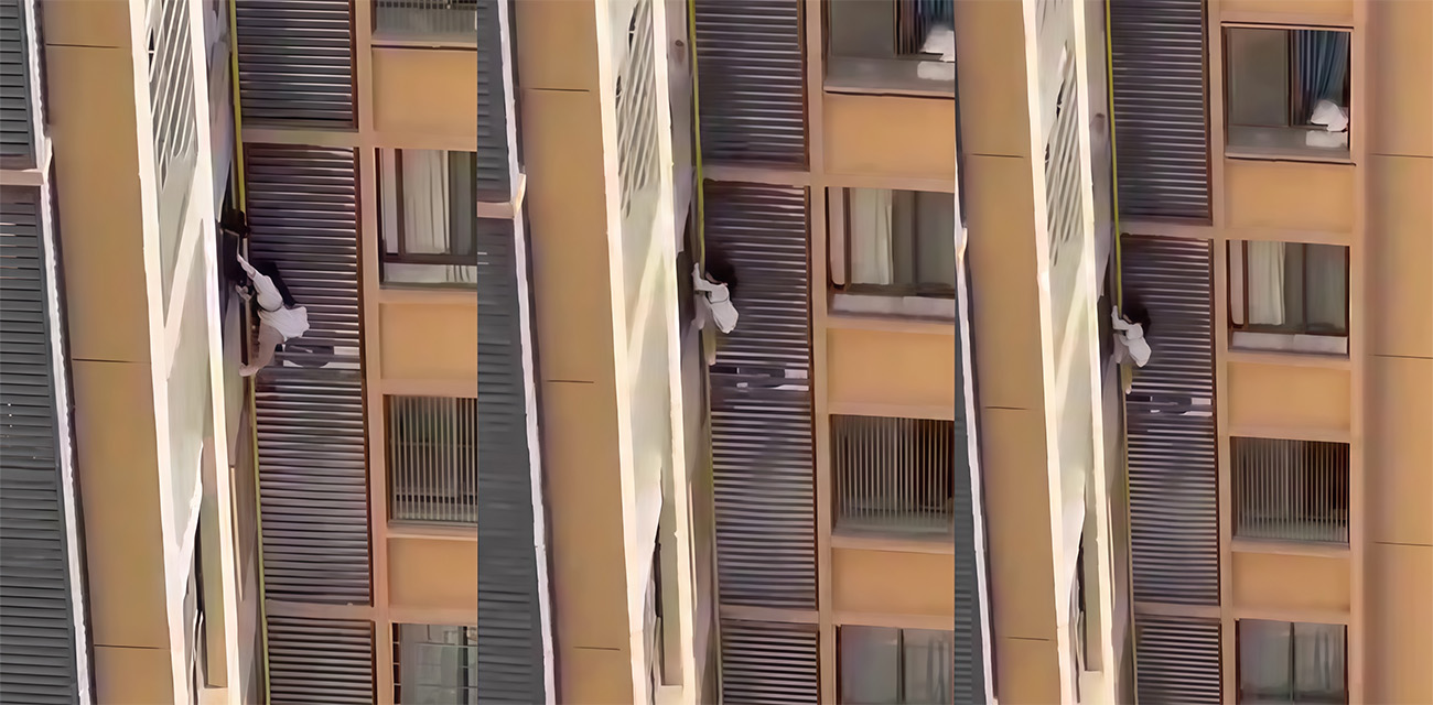 名穿白短裙的女子与半裸男子正在房间时 正室突然杀到 女子竟从窗户爬出外墙