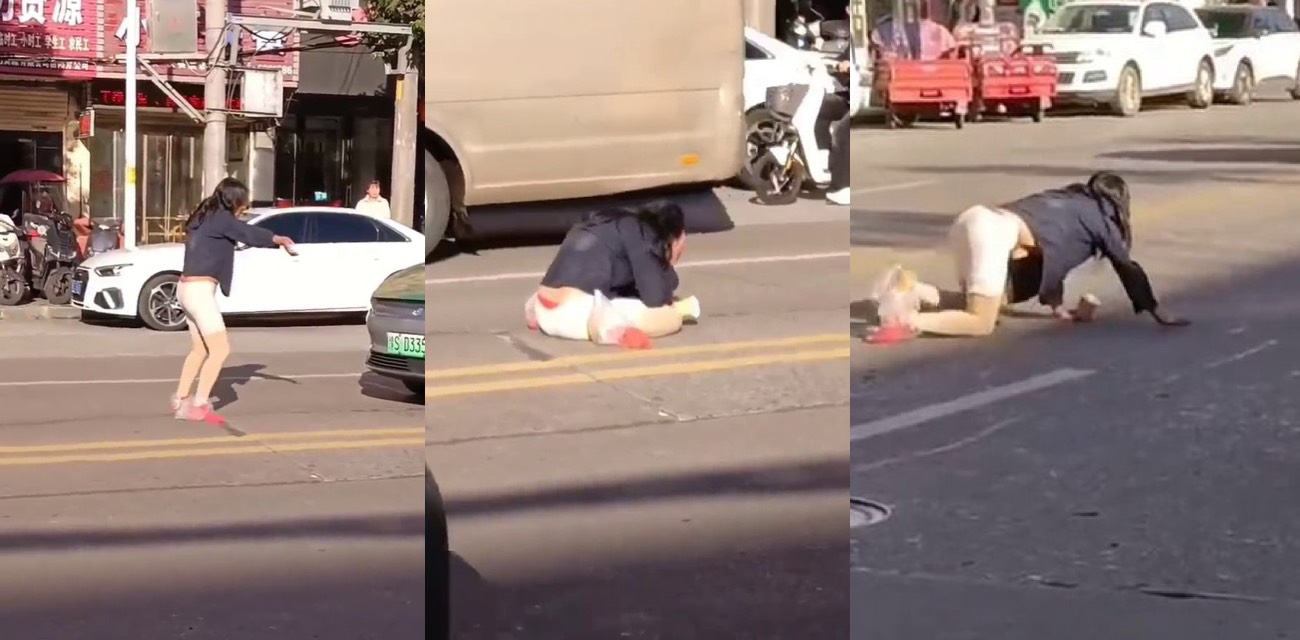 河南信阳女子马路疯狂拦车装疯卖傻 手舞足蹈满街跑惊呆司机路人围观