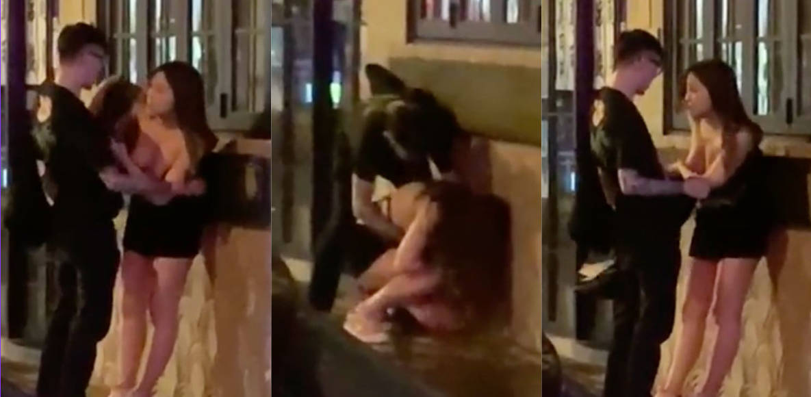 港女街头醉酒半裸上身露出双乳，男伴围衫使劲揩油！