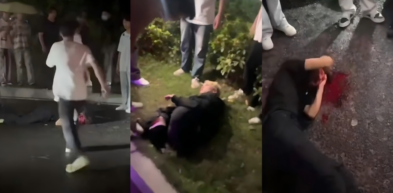 江西万载深夜马路霸凌 俩小伙被围殴 满头血倒地 绿化带里拳脚不停 太狠了