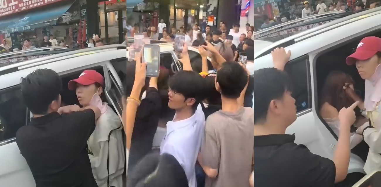 南宁西乡塘街头 原配带娃怒拦车抓小三 出轨男车大喊要原配好看