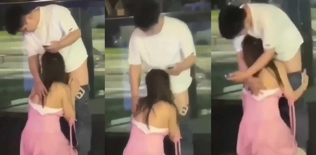 闹市街头惊爆一幕 白衣男粉裙女当众亲密口交 路人看呆