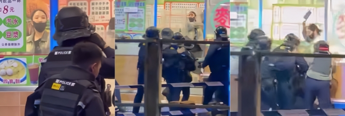 香港上水凌晨 猛女持剪刀与菜刀袭警 对峙警方狂砍警盾被合力制服！