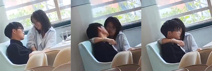校园情侣公众场所秀恩爱 动作十分不雅 女友一脸关心！