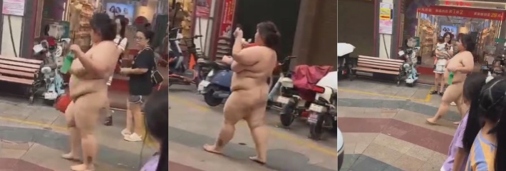 大马路上惊现野生母猪 闹市区全裸散步犹入无人之境 这赘肉都快掉在地上了