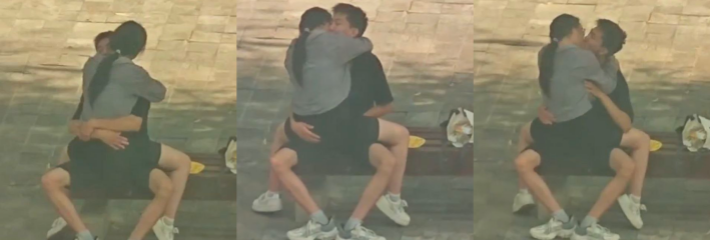 小情侣在长椅上亲密 男的手在干嘛啊 又是揉胸 又是抠逼的 没钱开房吗？