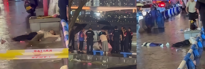 重庆洪崖洞景区 两名路人疑似触电 双双倒在积水中 现场视频曝光