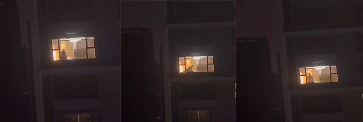 偷拍对面楼在窗前疯狂做爱 夜晚落地窗前猛男后入操的女的直接臣服 看得人偷拍者欲火难抑