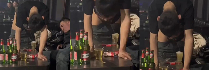 哥们喝多了竟当场尿在杯子里 看呆后面的兄弟:你是想让他干了这杯尿酒吗？