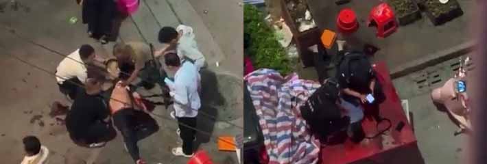 广西百色乐业县 一水果摊商贩与帽子叔叔发生争执后 竟持刀当街威胁 后被围观群众合力救出！