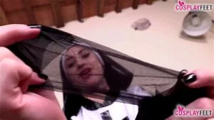 Tattoed nun takes off pantyhose and uses feet to excite you