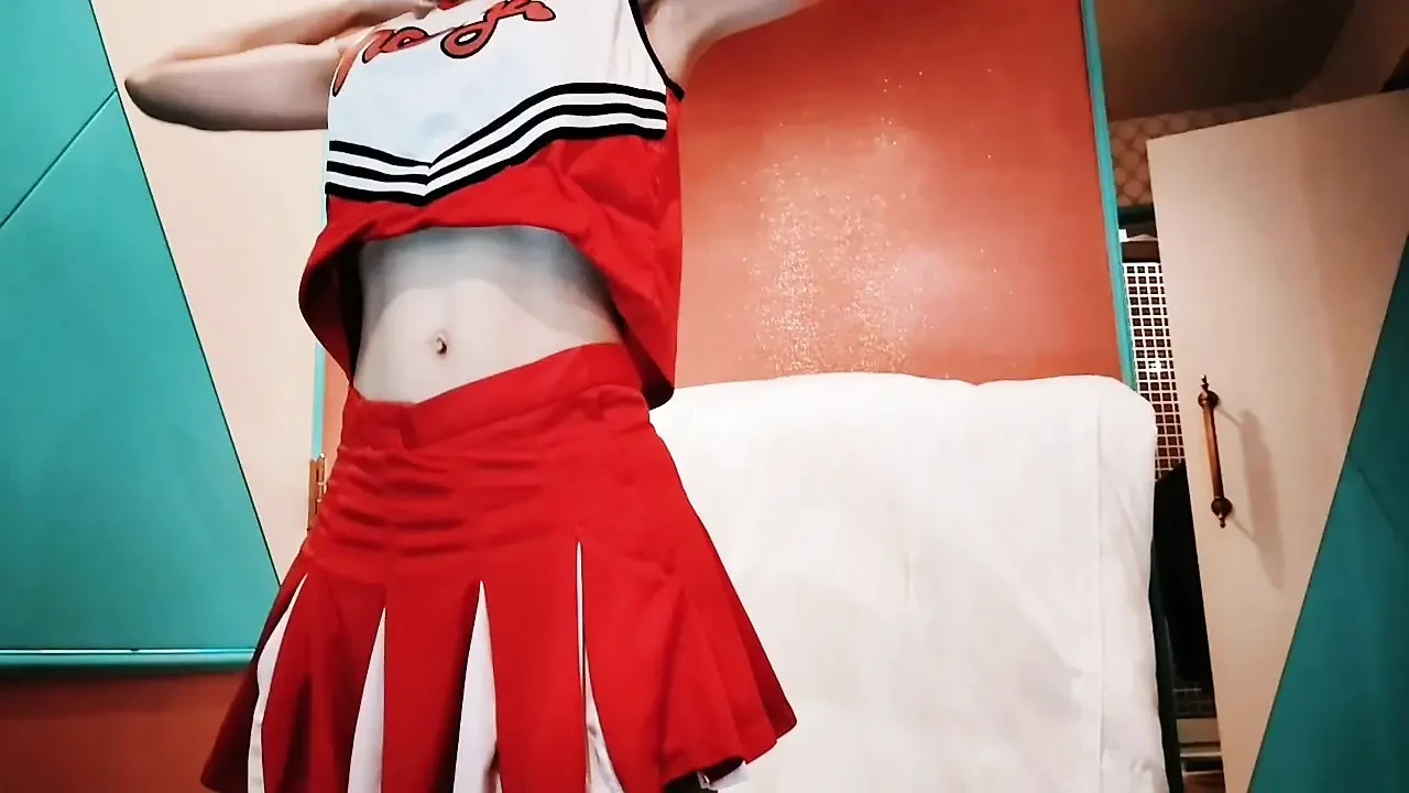 A cute, busty married woman does exercise 1 in an erotic cheerleader costume. Home made amateur Private Shoot