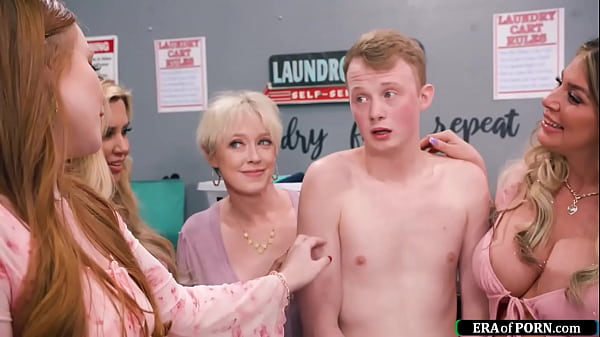 five_big_tits_milfs_decide_to_give_a_clueless_guy_a_helping_hand_with_the_laundry.the_cougars_take_off_his_shorts_and_give_him_a_deepthroat_blowjob